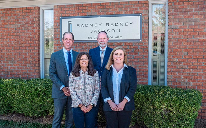 The legal team at Radney, Radney & Jackson, LLC, outside the firm's office
